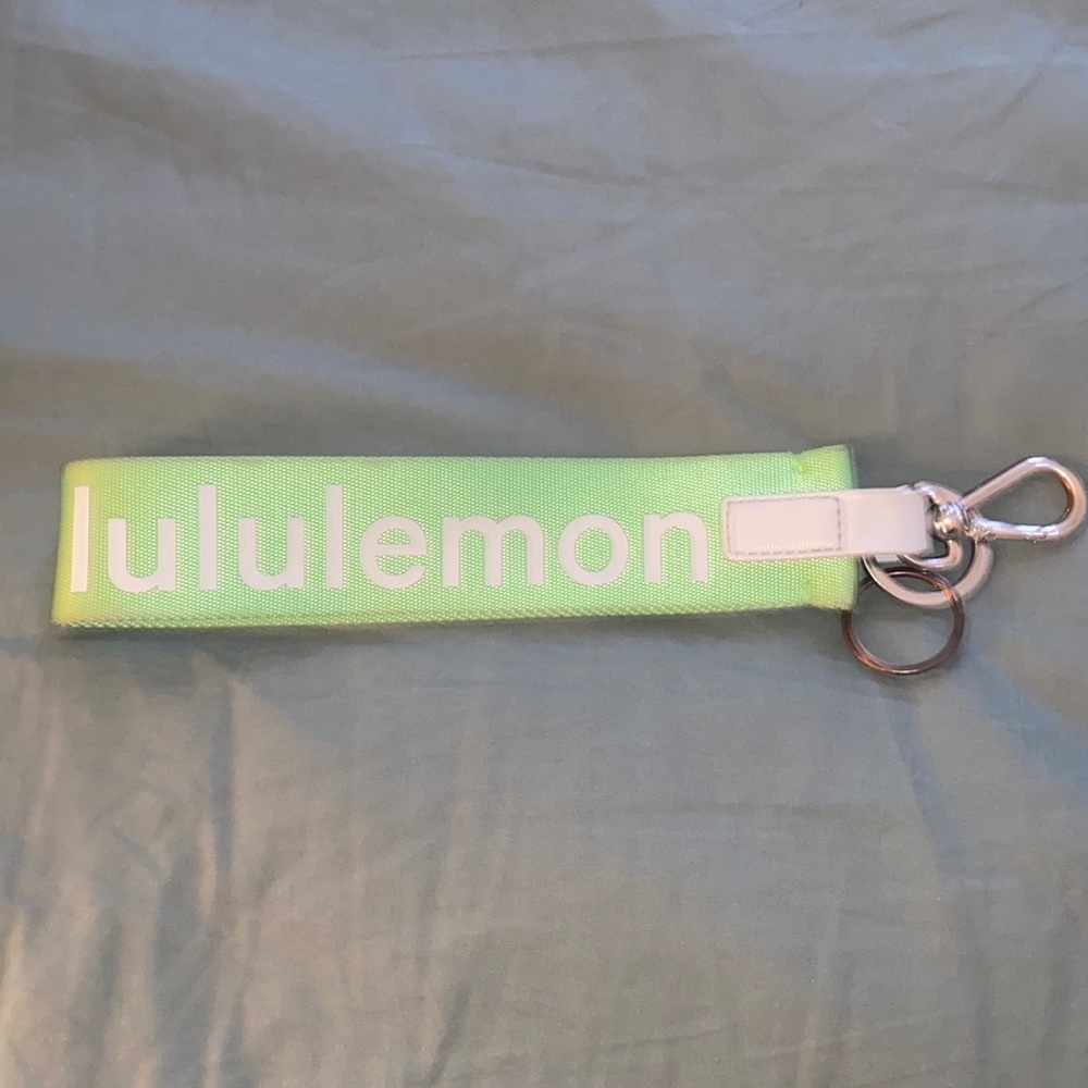 lululemon bright green keychain used